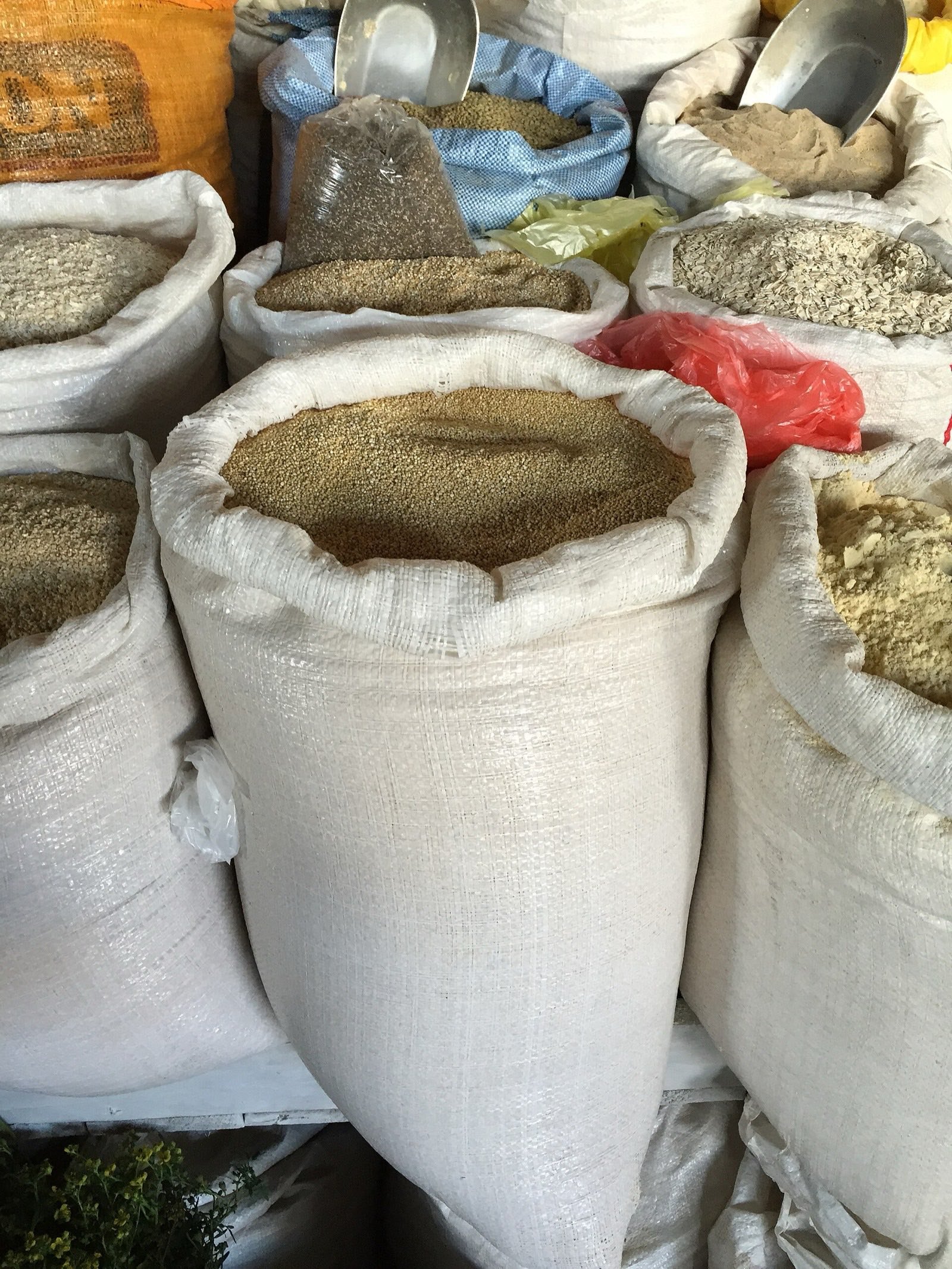 Sacks of grain stacked in the market
